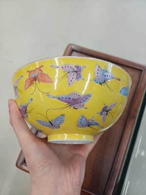 Lot 96 - A Chinese famille-rose yellow-ground 'butterfly' bowl, Qing dynasty, Tongzhi mark and period