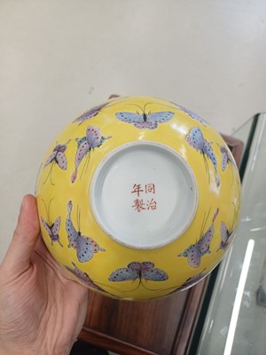 Lot 96 - A Chinese famille-rose yellow-ground 'butterfly' bowl, Qing dynasty, Tongzhi mark and period