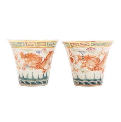 Lot 614 - A pair of Chinese famille-rose 'dragon and phoenix' cups, 20th century