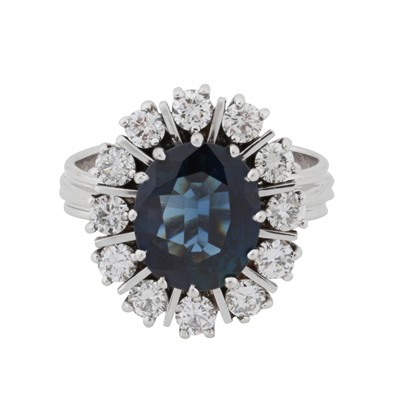 Lot 31 - A sapphire and diamond halo ring