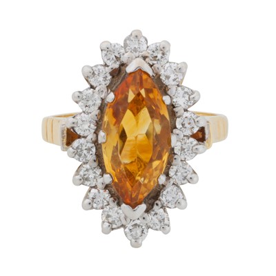 Lot 194 - A citrine and diamond halo ring