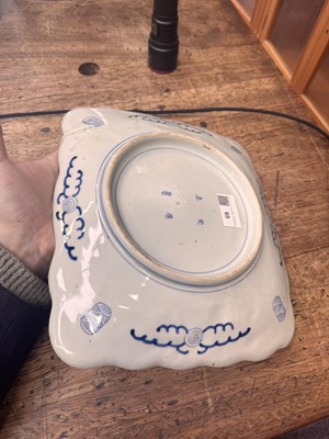 Lot 65 - A Japanese Arita blue and white 'map' dish, Edo period, circa 1830-1843