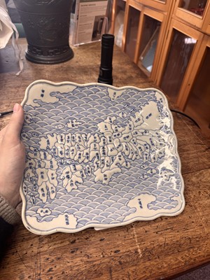 Lot 65 - A Japanese Arita blue and white 'map' dish, Edo period, circa 1830-1843