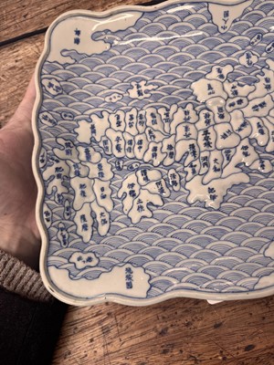 Lot 65 - A Japanese Arita blue and white 'map' dish, Edo period, circa 1830-1843
