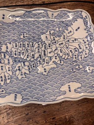 Lot 65 - A Japanese Arita blue and white 'map' dish, Edo period, circa 1830-1843