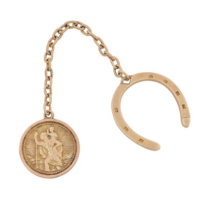 Lot 188 - A horseshoe charm with a St Christopher pendant