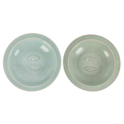 Lot 608 - Two Chinese celadon 'twin fish' dishes, 19th/20th century