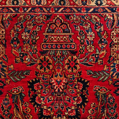 Lot 65 - An antique Sarouk carpet, west Persia