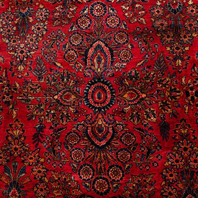Lot 65 - An antique Sarouk carpet, west Persia
