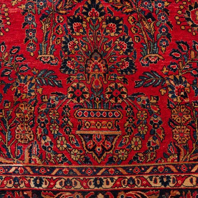 Lot 65 - An antique Sarouk carpet, west Persia