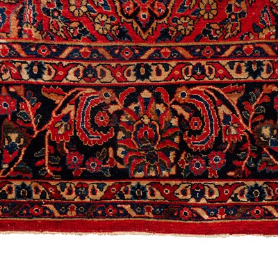 Lot 65 - An antique Sarouk carpet, west Persia