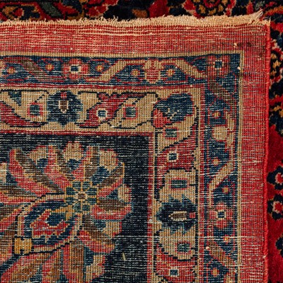 Lot 65 - An antique Sarouk carpet, west Persia