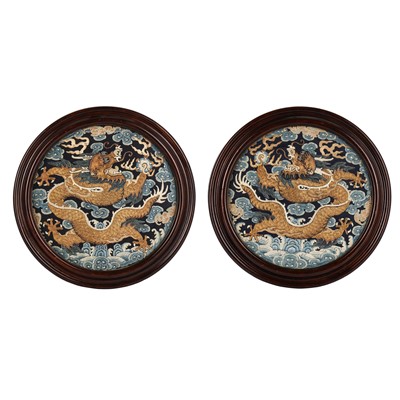 Lot 192 - A pair of Chinese silk embroidered 'dragon' roundels, Qing dynasty, 18th / 19th century