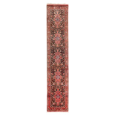 Lot 101 - An extremely fine silk Qum runner, central Persia