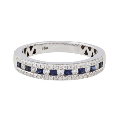 Lot 22 - A sapphire and diamond eternity ring