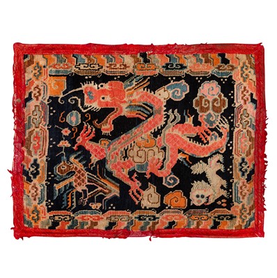 Lot 22 - An antique Tibetan rug