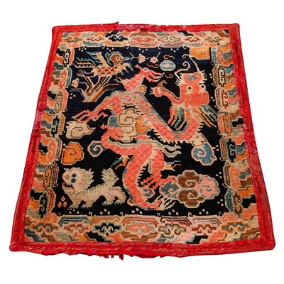 Lot 22 - An antique Tibetan rug