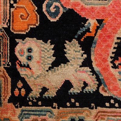 Lot 22 - An antique Tibetan rug