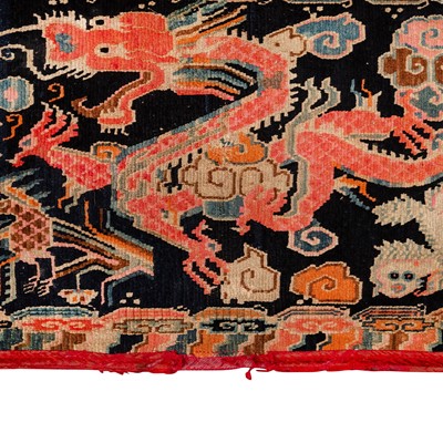 Lot 22 - An antique Tibetan rug
