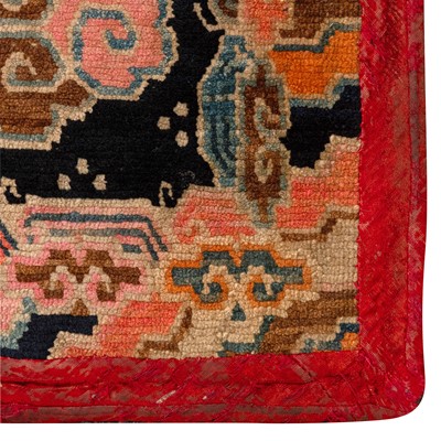 Lot 22 - An antique Tibetan rug