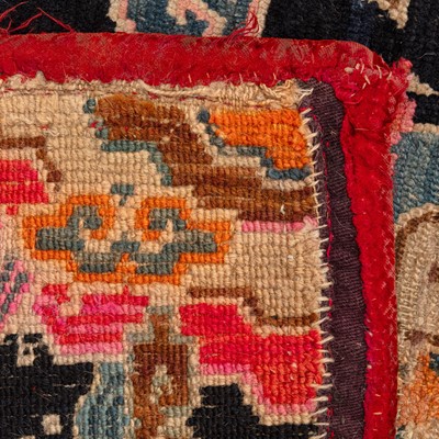 Lot 22 - An antique Tibetan rug