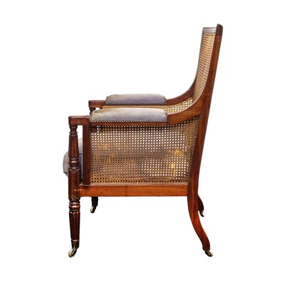 Lot 16 - A Regency mahogany bergère armchair in the manner of Gillows