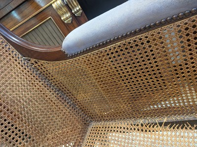 Lot 16 - A Regency mahogany bergère armchair in the manner of Gillows