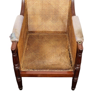 Lot 16 - A Regency mahogany bergère armchair in the manner of Gillows