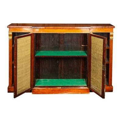 Lot 4 - A Regency rosewood and parcel gilt breakfront open bookcase in the manner of Gillows