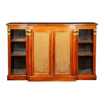 Lot 4 - A Regency rosewood and parcel gilt breakfront open bookcase in the manner of Gillows