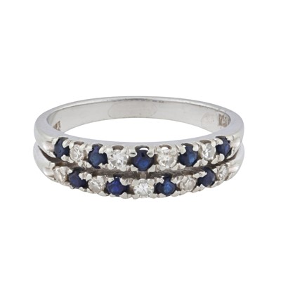 Lot 23 - A two row sapphire and diamond half eternity ring