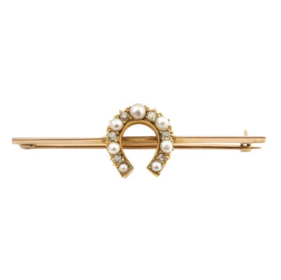 Lot 417 - A pearl and diamond horseshoe brooch