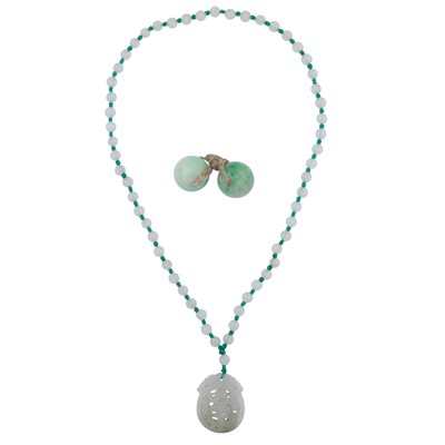 Lot 157 - A white jadeite pendant necklace and a pair of jadeite medicine balls