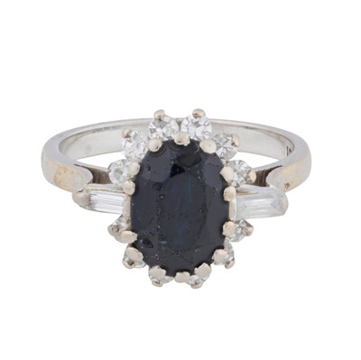 Lot 34 - A sapphire and diamond halo ring