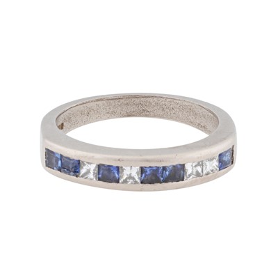 Lot 26 - A sapphire and diamond half eternity ring
