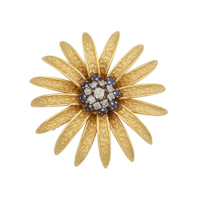 Lot 62 - A diamond and sapphire flower brooch, circa 1967