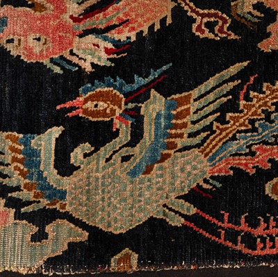 Lot 25 - An antique Tibetan rug