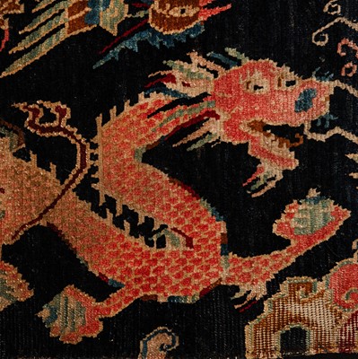 Lot 25 - An antique Tibetan rug