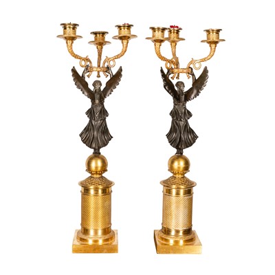 Lot 68 - Pair of French Empire bronze and ormolu candelabra