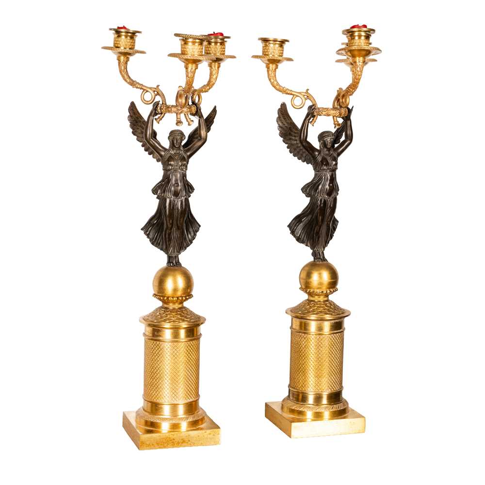 Lot 68 - Pair of French Empire bronze and ormolu candelabra