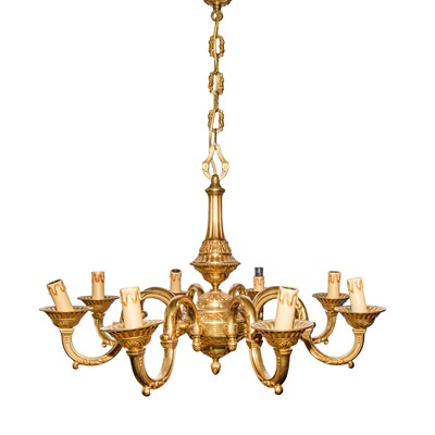 Lot 453 - A contemporary brass eight-branch chandelier, attributed to Theodore Alexander