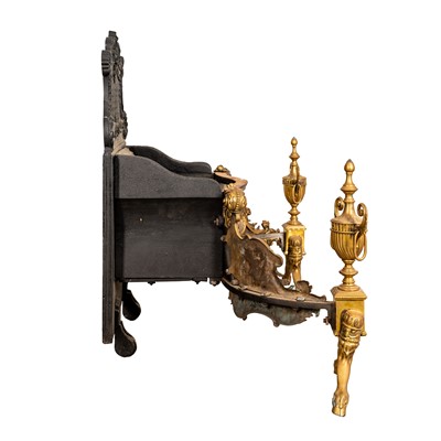 Lot 40 - A late Victorian Brass and cast iron fire grate, late 19th century