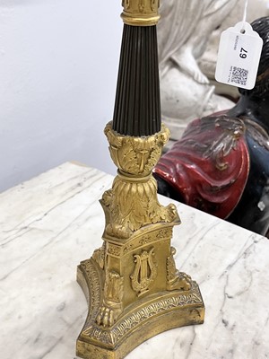 Lot 67 - A pair of Napoleon III period bronze and parcel gilt candelabra, circa 1860