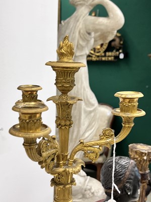 Lot 67 - A pair of Napoleon III period bronze and parcel gilt candelabra, circa 1860