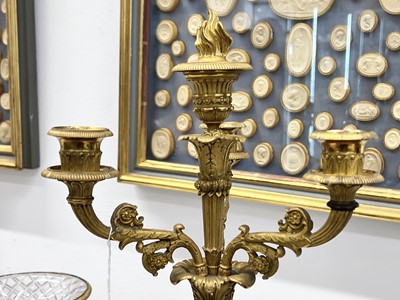 Lot 67 - A pair of Napoleon III period bronze and parcel gilt candelabra, circa 1860