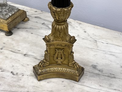 Lot 67 - A pair of Napoleon III period bronze and parcel gilt candelabra, circa 1860