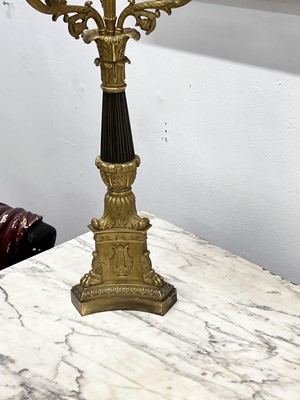 Lot 67 - A pair of Napoleon III period bronze and parcel gilt candelabra, circa 1860