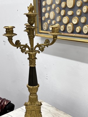 Lot 67 - A pair of Napoleon III period bronze and parcel gilt candelabra, circa 1860