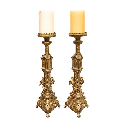 Lot 73 - A pair of Reformed Gothic gilt brass altar candlesticks, late 19th century