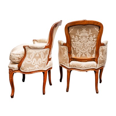 Lot 4 - A pair of Louis XV style walnut bergère armchairs